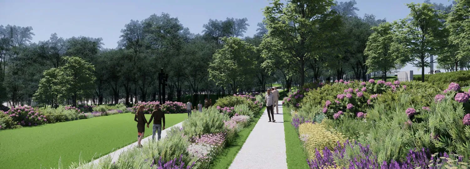 Des personnes marchent dans un parc fleuri
